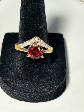 Gold Ring with Red Center Stone and Clear Accents